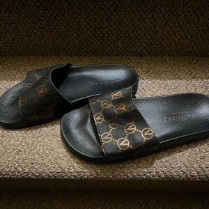 Valentino Women’s Black and Gold Slides
